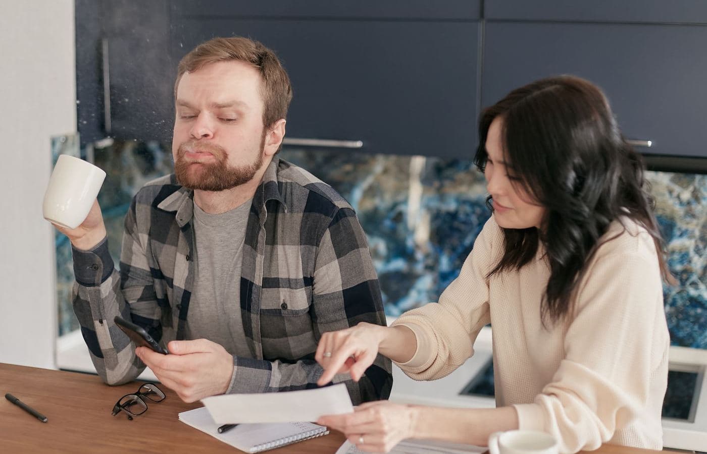A couple reviewing household bills together