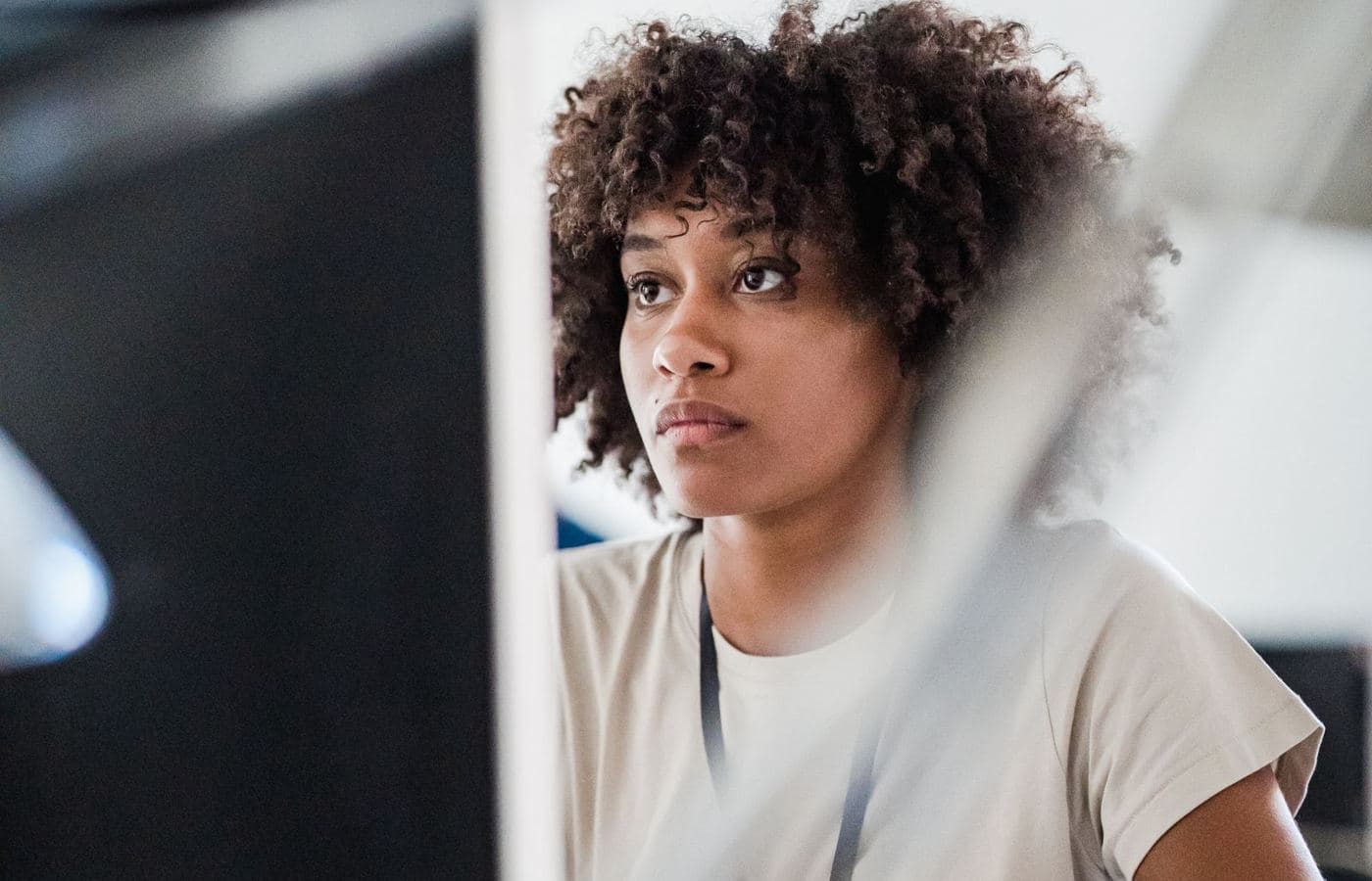 A woman reviewing information on her computer